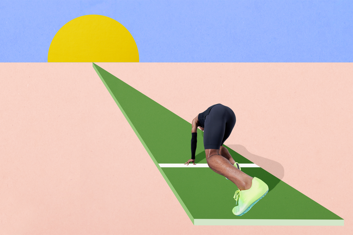 Athlete crouching down before running a race.
