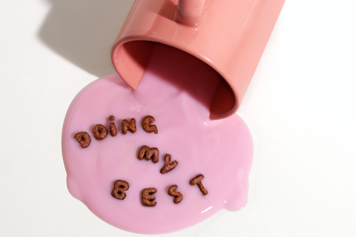 Mug will spilt liquid which has alphabet cereal letters which reads: 'Doing my best'.