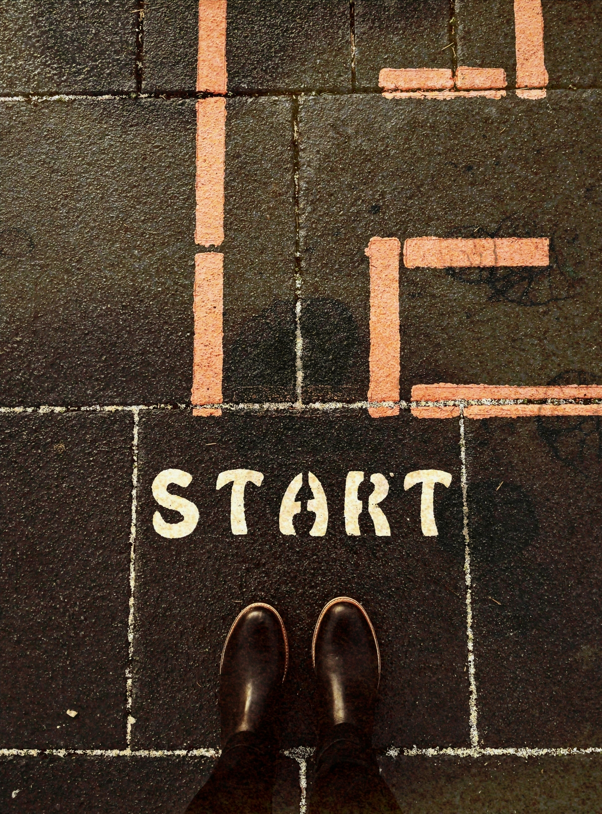 The word 'start' painted on the concrete